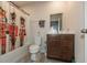 This cozy bathroom features a single vanity, a toilet, and a shower/tub combo with nutcracker curtain at 3219 E Maygrove Dr, Danville, IN 46122
