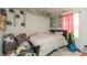 A bedroom featuring a queen-size bed and decorative wall accents with natural lighting at 3219 E Maygrove Dr, Danville, IN 46122