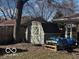 Backyard shed and storage area are nestled near the home's covered patio space at 3337 Nottingham Dr, Columbus, IN 47203