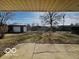 View of a backyard featuring a detached shed and an outdoor seating area at 3337 Nottingham Dr, Columbus, IN 47203