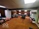 Spacious basement features wood paneling and multiple areas for storage and living at 3337 Nottingham Dr, Columbus, IN 47203
