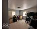 Bedroom with carpet, two windows, overhead lighting, and closet space at 3337 Nottingham Dr, Columbus, IN 47203