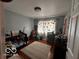 Charming bedroom featuring hardwood floors, a large window and plenty of natural light at 3337 Nottingham Dr, Columbus, IN 47203