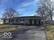 Charming single-story home featuring a long driveway and attached carport at 3337 Nottingham Dr, Columbus, IN 47203