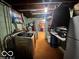 Laundry room with washer/dryer, overhead lighting and shelves for storage at 3337 Nottingham Dr, Columbus, IN 47203