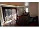 Comfortable main bedroom featuring hardwood floors and natural light at 3337 Nottingham Dr, Columbus, IN 47203