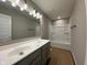 Bright bathroom featuring a double sink vanity and tub-shower combination at 335 Atlas Dr, Lebanon, IN 46052
