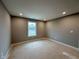 Cozy bedroom with a neutral paint color, carpeted flooring, and a window at 335 Atlas Dr, Lebanon, IN 46052