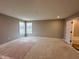 Large bedroom with natural lighting from the two windows with access to the bathroom at 335 Atlas Dr, Lebanon, IN 46052