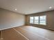 Spacious living room with three large windows offering natural light at 335 Atlas Dr, Lebanon, IN 46052