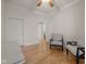 Bedroom features neutral color palette, wood floor, and two entry doors at 355 E Ohio E St # 206, Indianapolis, IN 46204