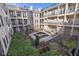 Exterior courtyard featuring water fountain, green space and residential facade at 355 E Ohio E St # 206, Indianapolis, IN 46204
