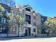 Beautiful brick condo building featuring black accents, private balconies and manicured trees at 355 E Ohio E St # 206, Indianapolis, IN 46204