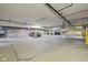 Large garage area with concrete floor, overhead lighting, and multiple parking spaces at 355 E Ohio E St # 206, Indianapolis, IN 46204