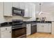 Functional kitchen with black stainless appliances and granite countertops offers great space and style at 355 E Ohio E St # 206, Indianapolis, IN 46204