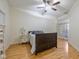 Comfortable bedroom with hardwood floors, fan and balcony access offering a relaxing retreat at 355 E Ohio E St # 206, Indianapolis, IN 46204