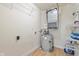 Storage area featuring wooden floor, water heater, wall mounted shelves and utility components at 355 E Ohio E St # 206, Indianapolis, IN 46204