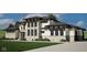 Beautiful two-story home with stone and stucco, dark trim windows, and a well-manicured lawn at 4094 Chapel Hill Ct, Bargersville, IN 46106