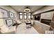 Stylish home office with custom built-ins, statement lighting, and modern furniture perfect for remote work at 4094 Chapel Hill Ct, Bargersville, IN 46106