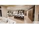 Open kitchen and dining area with a large island, modern pendant lights, and a view of the backyard at 4094 Chapel Hill Ct, Bargersville, IN 46106