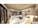 Bright, open-concept living room flows into the kitchen and dining areas with large windows and modern decor at 4094 Chapel Hill Ct, Bargersville, IN 46106