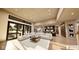 Bright, open-concept living room features a large sectional couch, modern lighting, and seamless flow into the kitchen at 4094 Chapel Hill Ct, Bargersville, IN 46106