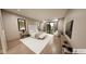 Cozy main bedroom featuring a large bed, soft lighting, a sitting area, and a sliding glass door at 4094 Chapel Hill Ct, Bargersville, IN 46106