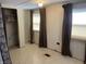 Bedroom featuring an empty closet, two windows with blinds, and patterned floors at 4107 E 37Th St, Anderson, IN 46017