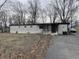 Charming single-story home with a front yard and a driveway at 4107 E 37Th St, Anderson, IN 46017
