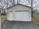 A detached garage features a white door, separate entry door, and driveway at 4107 E 37Th St, Anderson, IN 46017