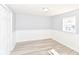 Spacious bedroom featuring light walls, modern floors, and a big closet at 4123 S Lynhurst Dr, Indianapolis, IN 46221