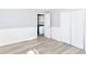 Large bedroom showing light-colored walls and an open door to the kitchen at 4123 S Lynhurst Dr, Indianapolis, IN 46221