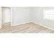 Bedroom features a large closet, light-colored walls, and a window at 4123 S Lynhurst Dr, Indianapolis, IN 46221