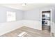 This bedroom offers great light, modern floors, and is conveniently near the kitchen at 4123 S Lynhurst Dr, Indianapolis, IN 46221
