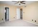 Spacious bedroom with neutral carpet, ceiling fan, closet and natural light at 4264 Foxglove Trce, Indianapolis, IN 46237
