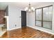 Dining room features a modern chandelier and wood floors at 4264 Foxglove Trce, Indianapolis, IN 46237