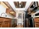 Updated kitchen features modern appliances, wood cabinets, granite countertops, and wood-look flooring at 4264 Foxglove Trce, Indianapolis, IN 46237