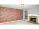 Spacious living room with a brick feature wall and stone fireplace at 4264 Foxglove Trce, Indianapolis, IN 46237