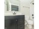 Bathroom with a black vanity and a tub-shower combo, all complemented by neutral wall colors at 4408 W Preserve Pass, New Palestine, IN 46163