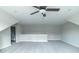 Open bonus room features soft gray carpet, modern ceiling fan and great lighting from recessed lights at 4408 W Preserve Pass, New Palestine, IN 46163