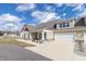 New construction home featuring a two-car garage, complementary siding colors, and a well-manicured lawn at 4408 W Preserve Pass, New Palestine, IN 46163