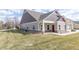 Inviting home with complementary siding colors, professional landscaping, and a covered porch at 4408 W Preserve Pass, New Palestine, IN 46163
