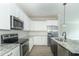 Stylish kitchen featuring granite countertops, stainless steel appliances, and white subway tile at 4408 W Preserve Pass, New Palestine, IN 46163