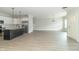Open floor plan with a view of a modern kitchen featuring a large island and stainless steel appliances at 4408 W Preserve Pass, New Palestine, IN 46163