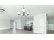 Open-concept living room and kitchen featuring an island and stainless steel appliances at 4408 W Preserve Pass, New Palestine, IN 46163