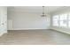 A light-filled living room with wood floors and large windows at 4408 W Preserve Pass, New Palestine, IN 46163