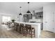 Open kitchen featuring a large island with bar stool seating and stainless-steel appliances at 447 Leota St, Indianapolis, IN 46203