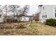 View of the backyard featuring garden beds, lawn, and the back of the house at 4644 Cornelius Ave, Indianapolis, IN 46208