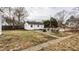Backyard with grass, patio, and shed with a picnic table and a fire pit at 4644 Cornelius Ave, Indianapolis, IN 46208