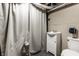 Basement bathroom area with sink, cabinet, toilet, and curtained shower at 4644 Cornelius Ave, Indianapolis, IN 46208